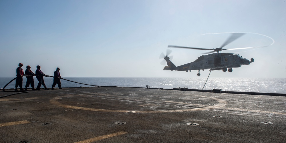 Helicopter inflight refueling exercise with USS Philippine Sea