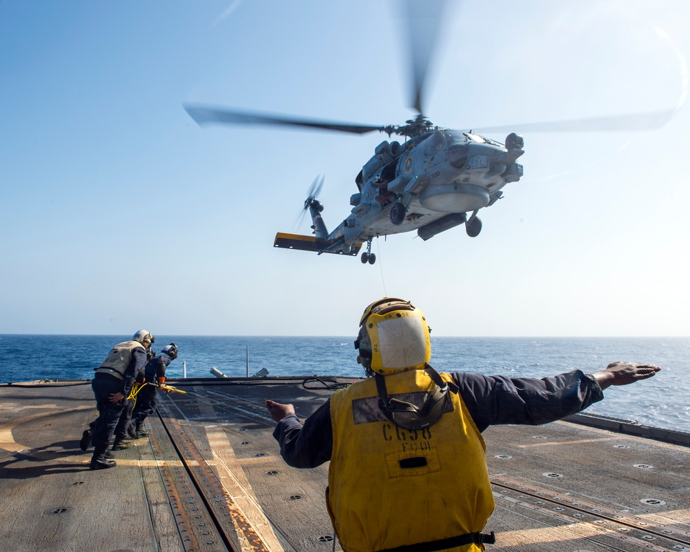 Helicopter inflight refueling exercise with USS Philippine Sea