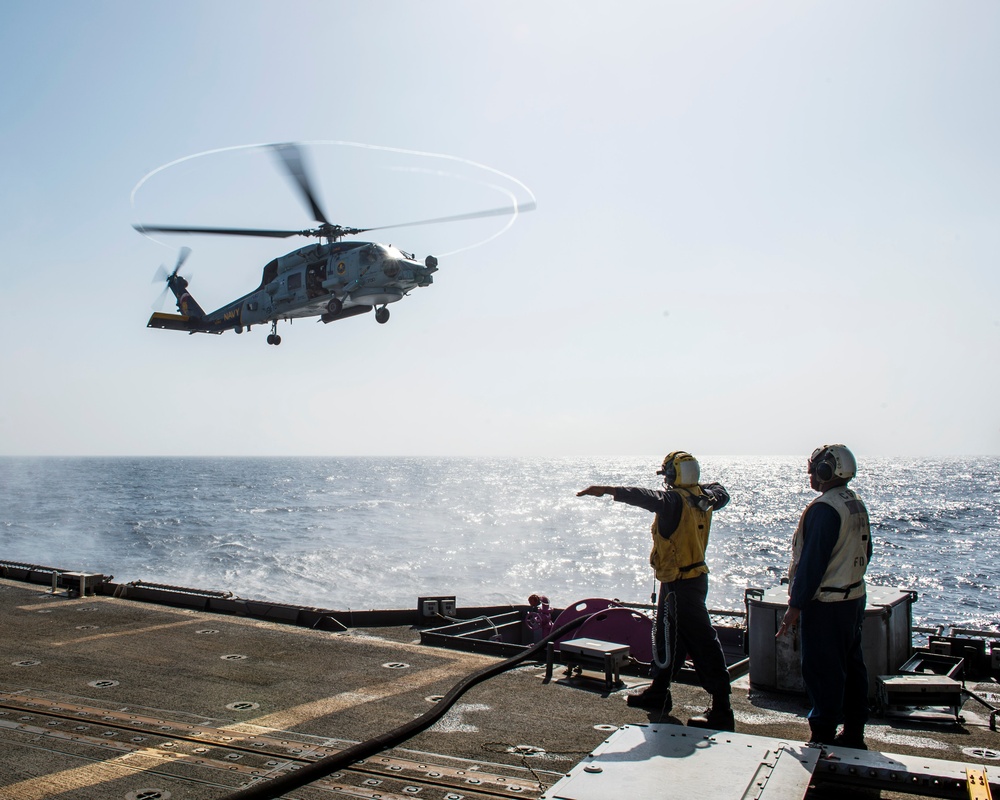 Helicopter inflight refueling exercise with USS Philippine Sea