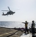 Helicopter inflight refueling exercise with USS Philippine Sea