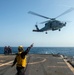 Helicopter inflight refueling exercise with USS Philippine Sea