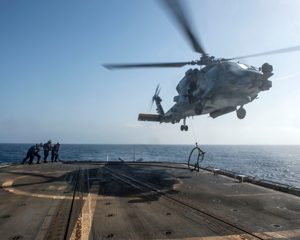 Helicopter inflight refueling exercise with USS Philippine Sea