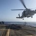 Helicopter inflight refueling exercise with USS Philippine Sea