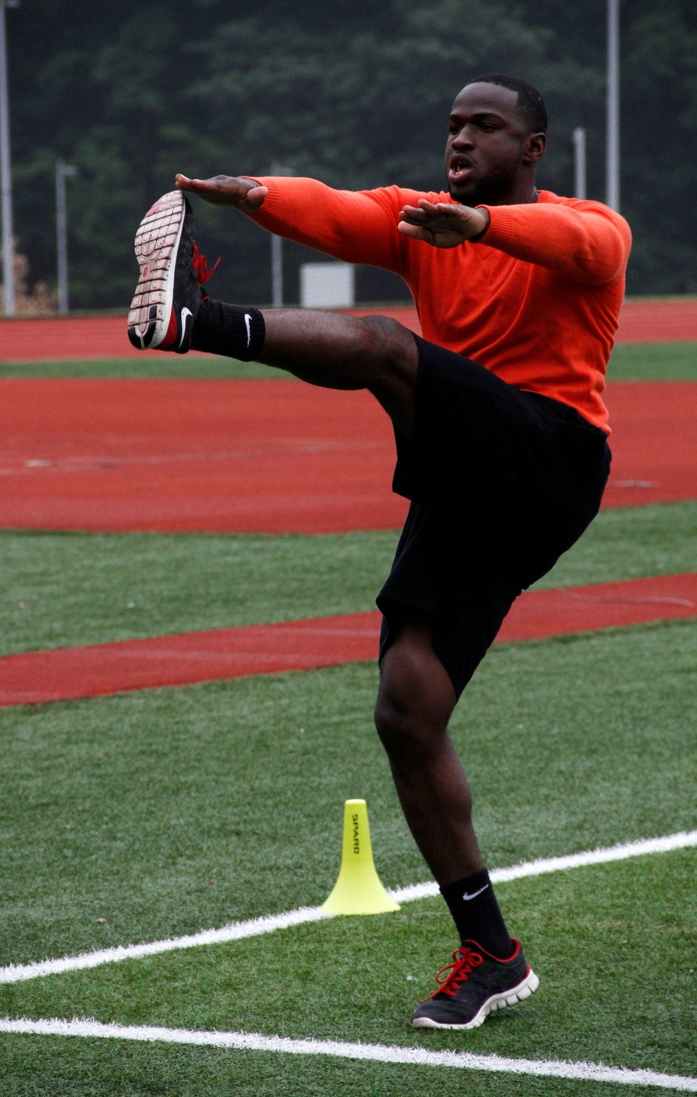 Pfc. Stafford, Army National Guard, Fort Steward, Ga., stretches for the 2014 Warrior Trials