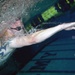 Lance Cpl. Fellows, US Marines, Warrior Transition Battalion, swims through the practice lane at the 2014 Warrior Trials