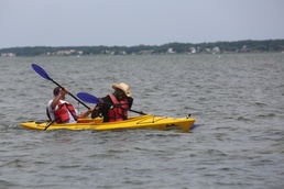 Community members kayak to finish line, support wounded warriors