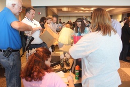 Dollar General donates backpacks for military youth camp
