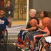 Wheelchair basketball coaches demonstrate ball-handling techniques at the 2014 Warrior Trials