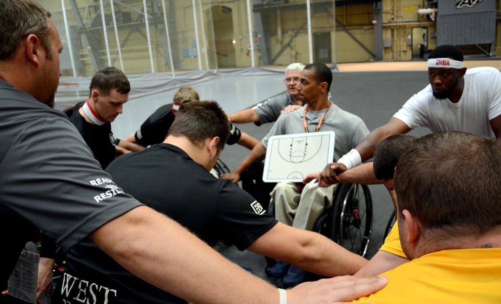 Army Team A huddles with coach before the game open against the Air Force at the Warrior Games