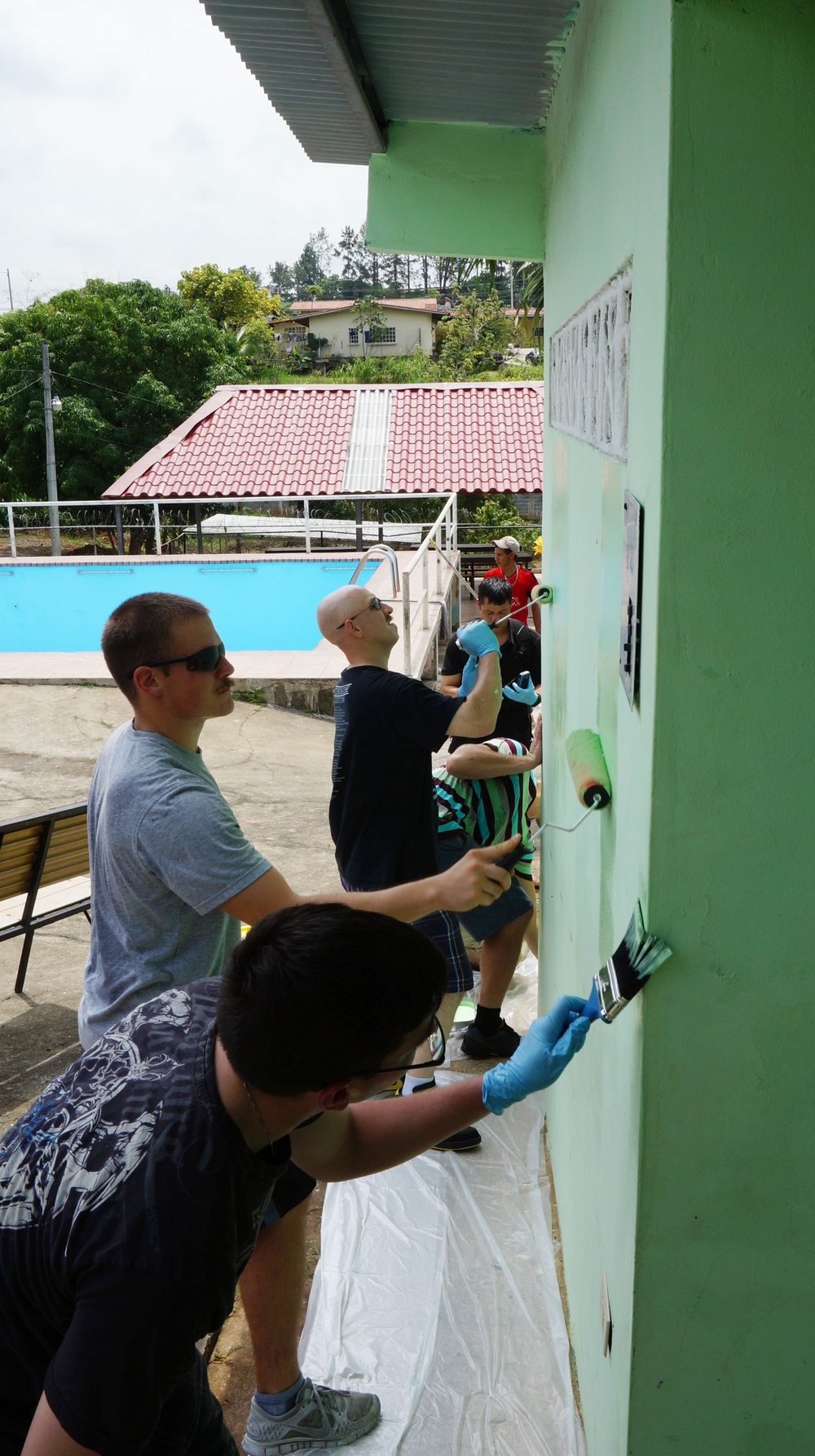 USS Ingraham Sailors repaint pool areas