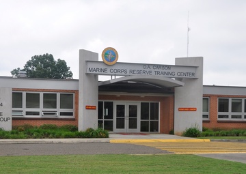 Fort Worth District energy project coordinator, Chelsey Click, inspects the D.A Carson Marine Corps Reserve Training Center maintenance bay exhaust piping for energy inefficiencies during a May 28 energy audit.