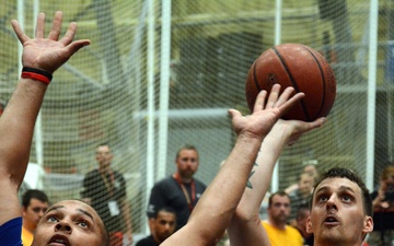 Army and Air Force athletes compete in the wheelchair basketball final game at the 2014 Warrior Trials