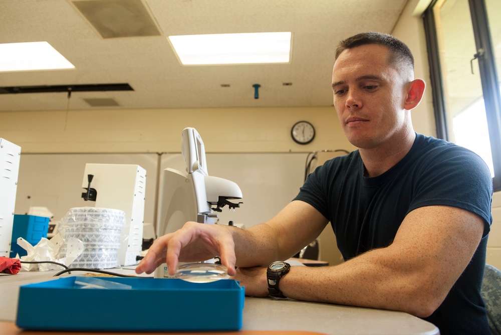 Service members provide optometry support during Tropic Care 2014 joint training