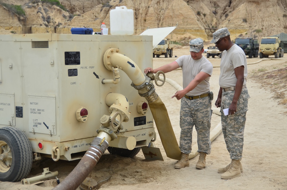 Soldiers from the 288th Quartermaster Detachment from Victoria, Texas, are conducting repairs on a water delivery system