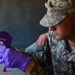Spc. Sean Walton, preventive medicine specialist from the 787th Medical Detachment, New Orleans, tests the chlorine levels in water samples