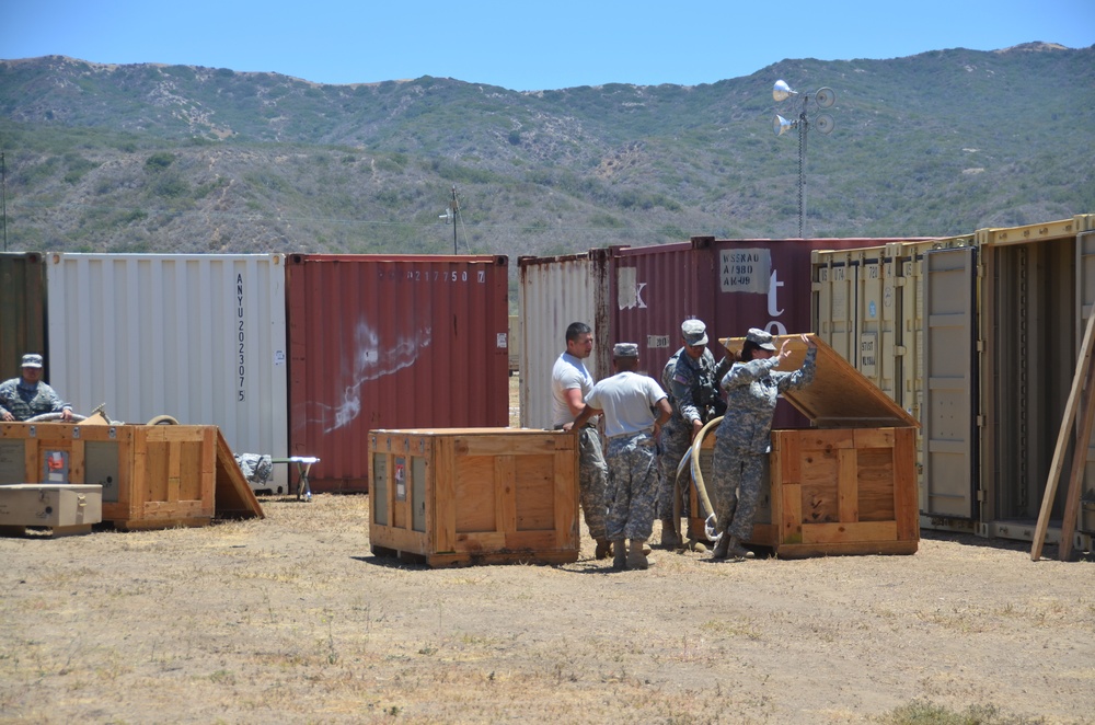 Soldiers unloading containers