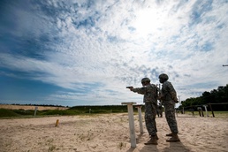 Soldiers fire rounds into pop-up targets during the 2014 Army Reserve Best Warrior Competition