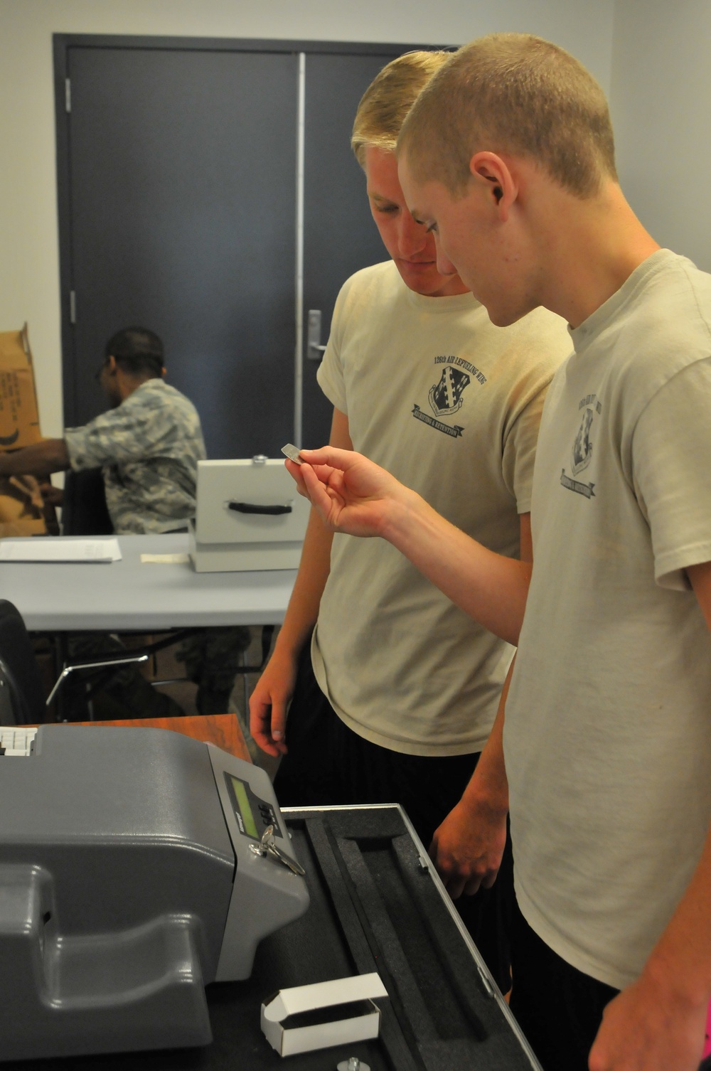 Student flight trainees help in the processing line