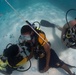 US Navy divers and Belizean Coast Guard divers practice SCUBA emergency procedures in a pool