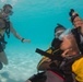 US Navy divers and Belizean Coast Guard divers practice SCUBA emergency procedures in a pool