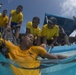 US Navy divers and Belizean Coast Guard divers practice SCUBA emergency procedures in a pool
