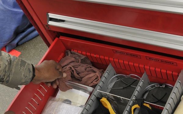 Crew chief inspects flight line tool box
