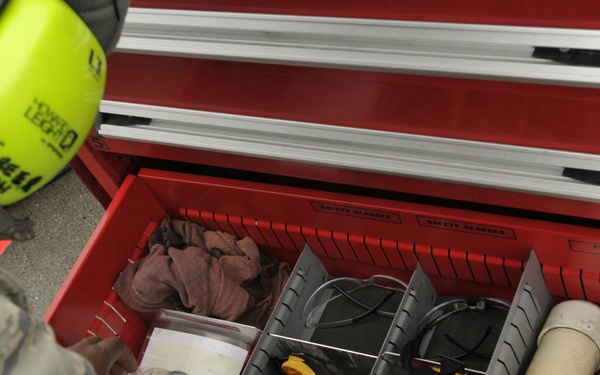 Crew chief inspects flight line tool box