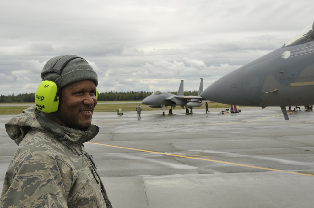 Crew chief prepares F-15C for takeoff