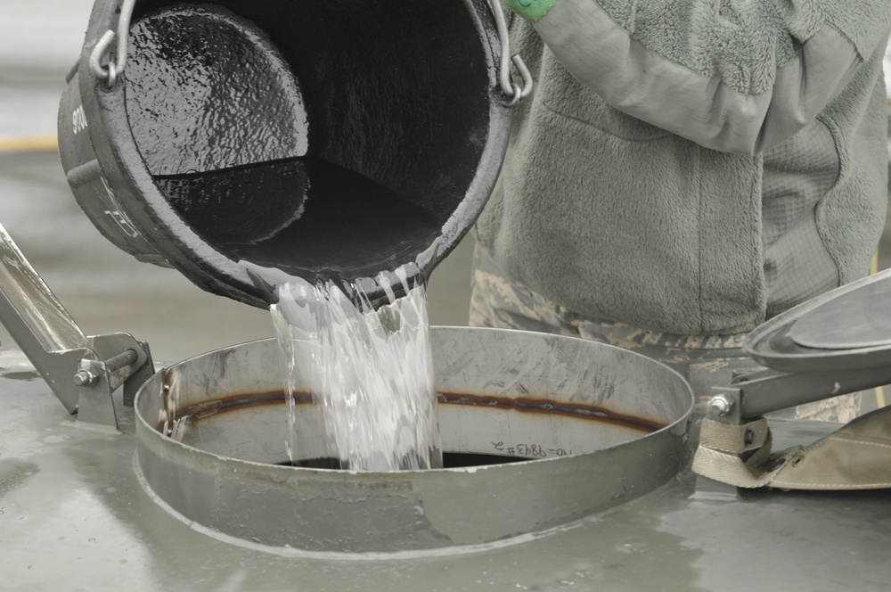 Airman drains F-15C surge boxes