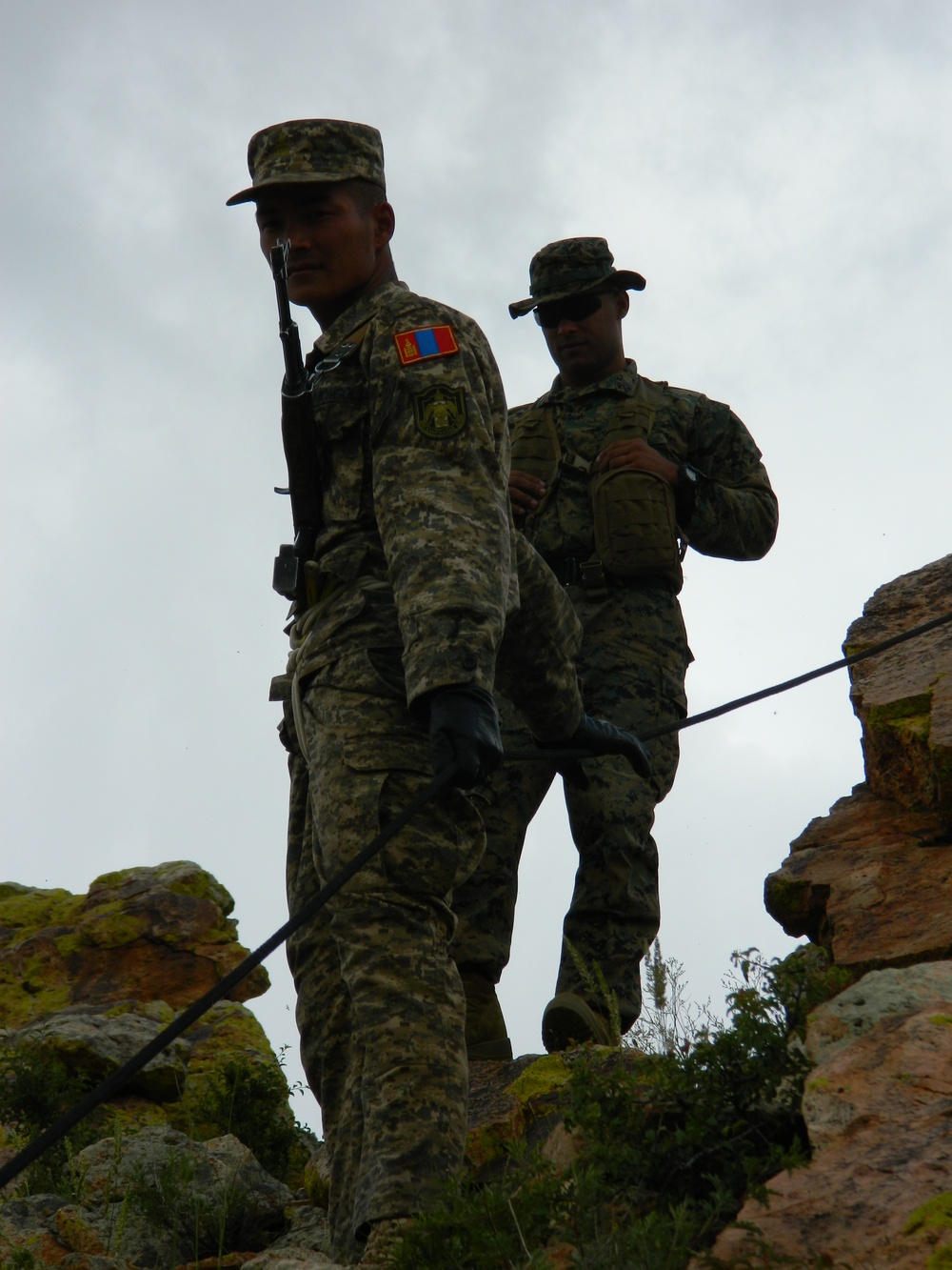 Mongolian Armed Forces members learn hasty rappelling techniques from US Marine instructors
