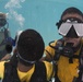 US Navy divers and Belizean coast guard divers practice SCUBA emergency procedures in a pool