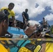 US Navy divers and Belizean coast guard divers practice SCUBA emergency procedures in a pool