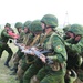 Soldiers from Tajikistan practice crowd control techniques at Khaan Quest 2014