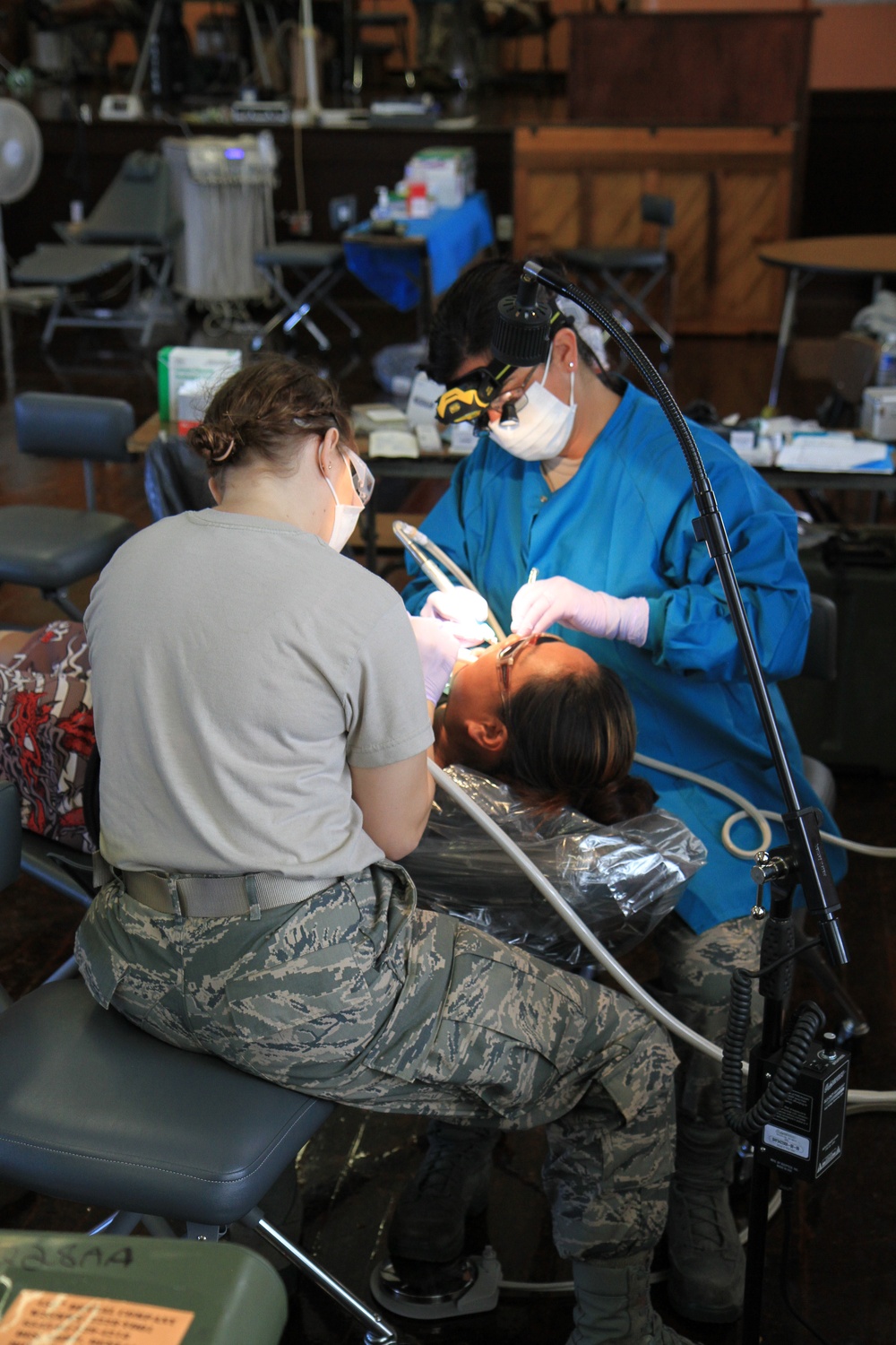 Air Force personnel provide dental work during Tropic Care 2014