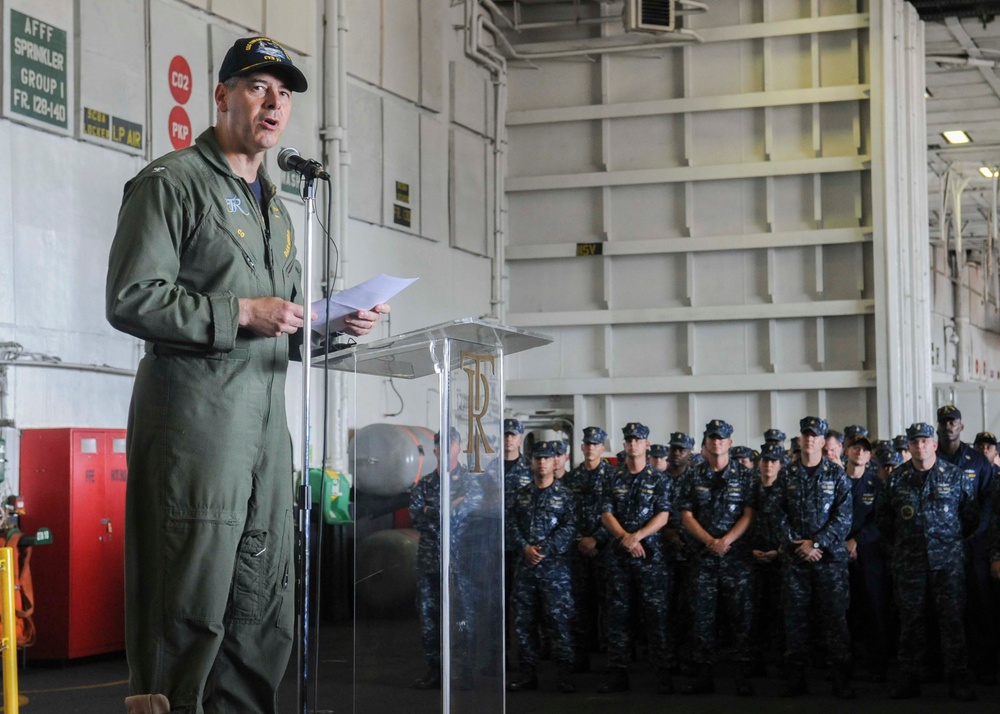 USS Theodore Roosevelt commanding officer addresses crew