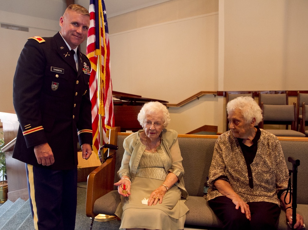 Col. Sanders presents WWII Victory Medal