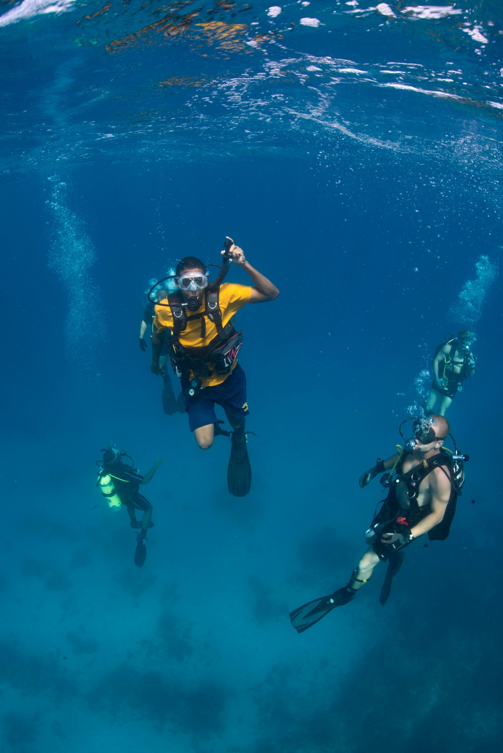 US Navy divers and Belizean Coast Guard divers work together during Southern Partnership Station '14