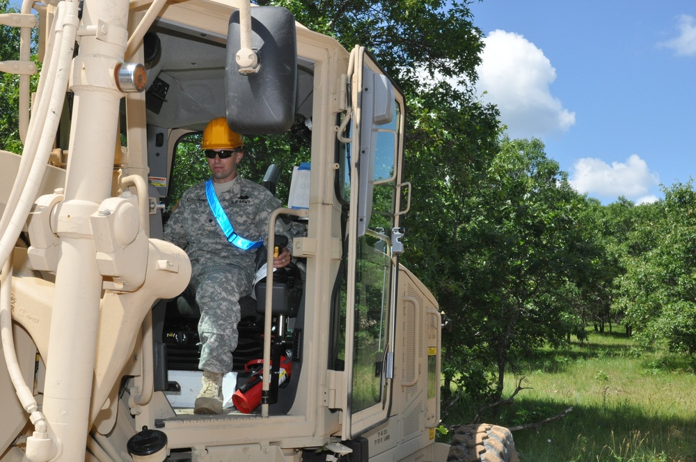 Army engineers upgrade a convoy trail