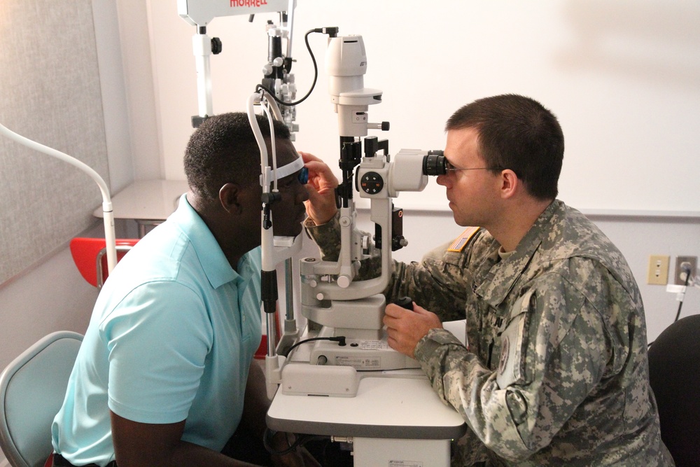Optometrist evaluates ocular health of patient