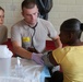 Health care specialists check vitals for patient during Northern Louisiana Care 2014