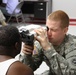 Optometry technician checks patient's eyes