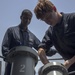 Sailors load anti-ship missile defense, chaff rounds