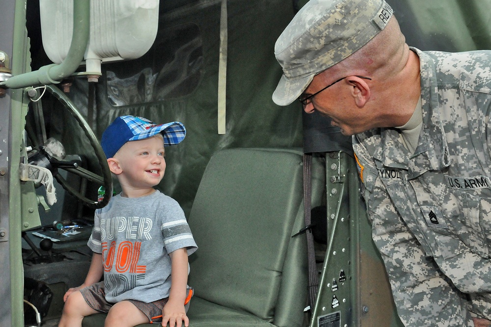 Army Reserve soldiers meet with local children during community event
