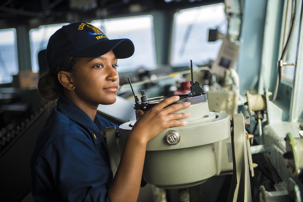 Ensign stands watch as conning officer on USS Kidd