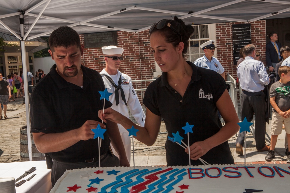 Montilo's bakery workers prepare ceremonial cake during the start of the annual Boston Harborfest