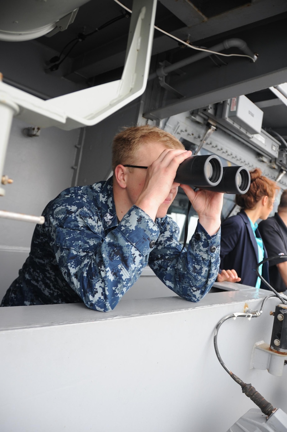 USS Theodore Roosevelt sailor looks at surface contact