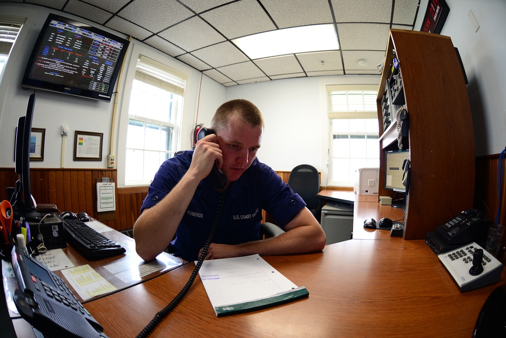 Coast Guard Station Humboldt Bay crewmember stands radio watch