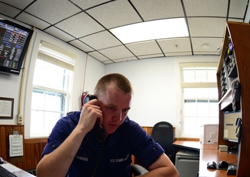 Coast Guard Station Humboldt Bay crewmember stands radio watch