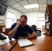 Coast Guard Station Humboldt Bay crewmember stands radio watch