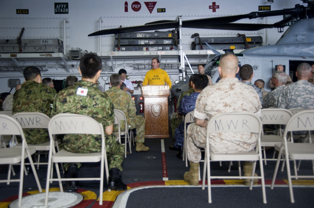 Distinguished visitors aboard USS Peleliu during RIMPAC 2014